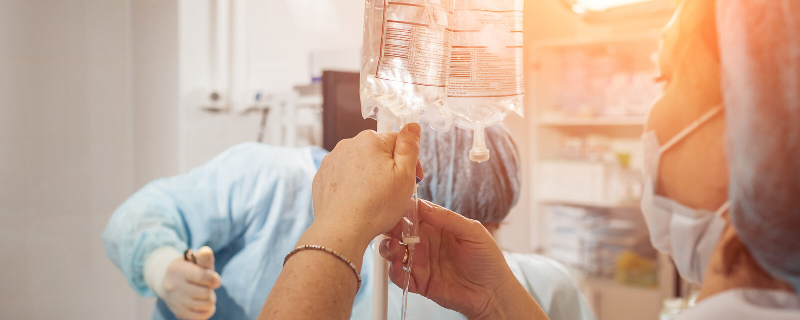 This is an image of a physician setting up chemotherapy medications to be used for a patient.
