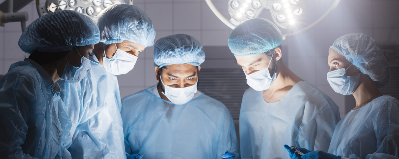 This is an image of surgeons' faces while performing an omentectomy.