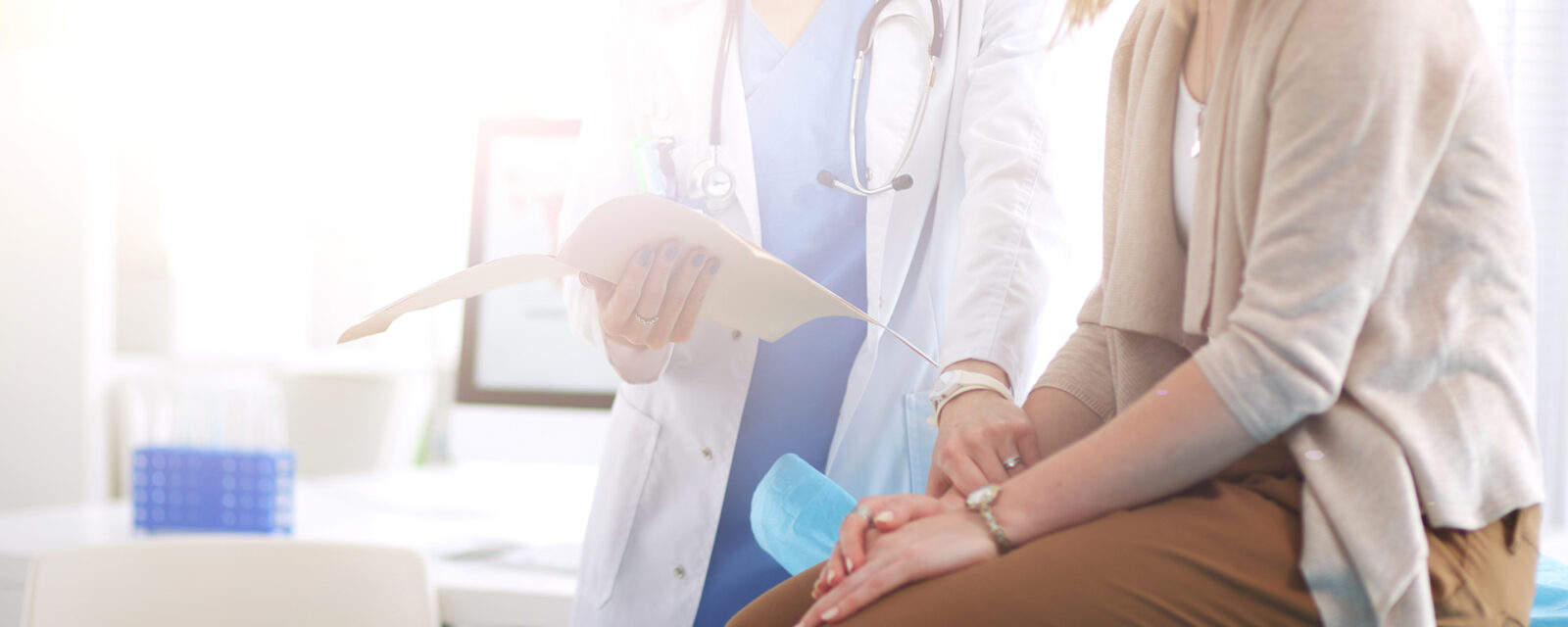 Image of a doctor consoling and explaining stage 1 mesothelioma to her patient.