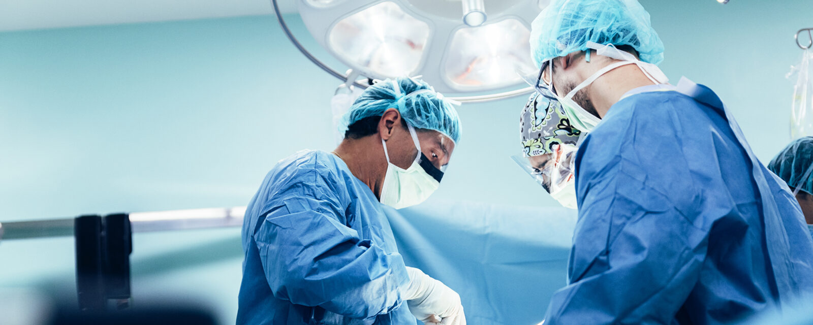 Low-view image of surgeons performing thorocoscopy.