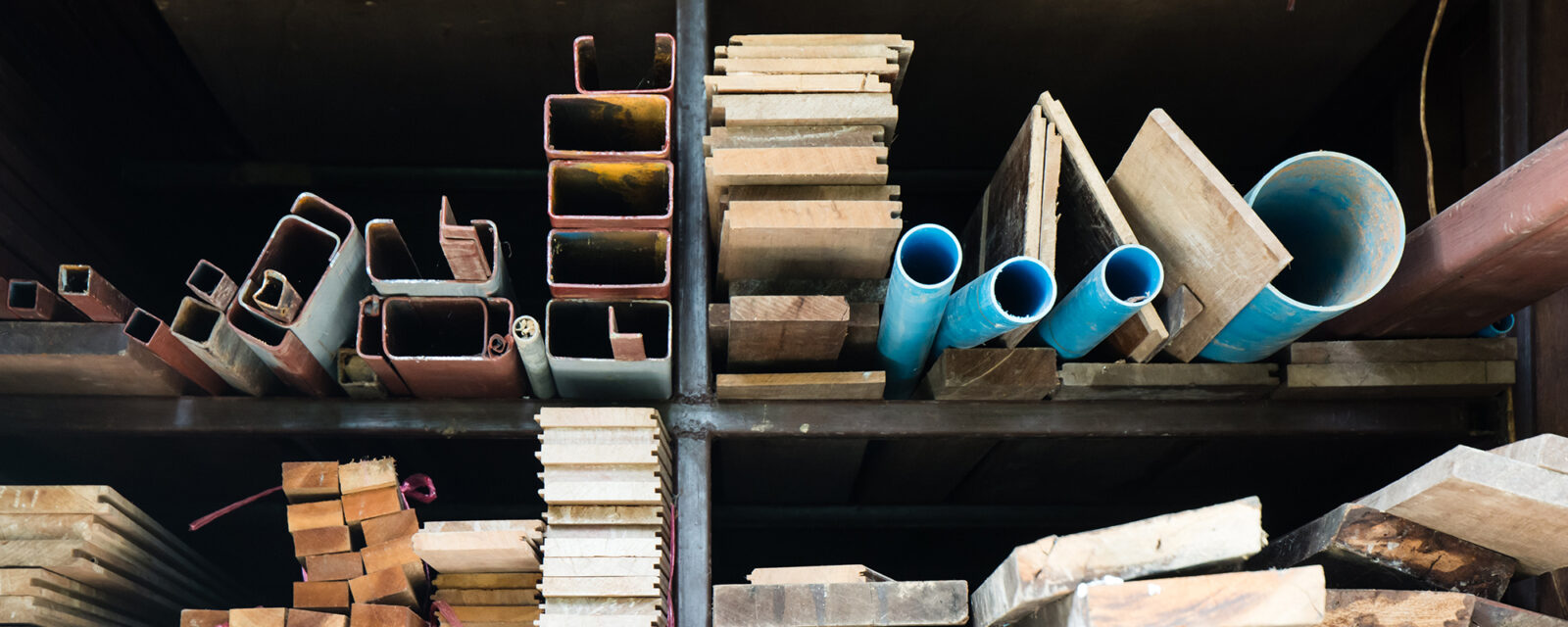 Image of a warehouse showing shelves and building materials.