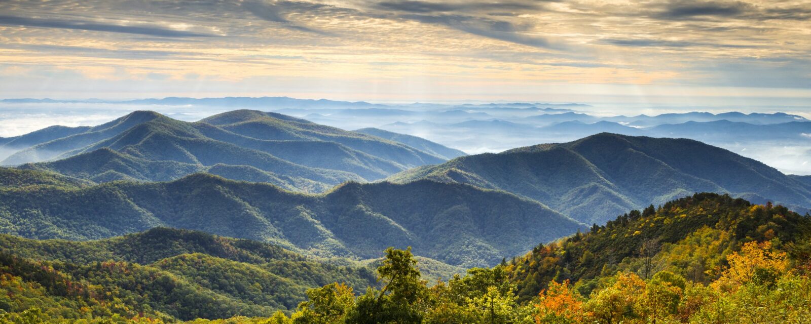 Mountain view of mountains, greenery, and sky in North Carolina.