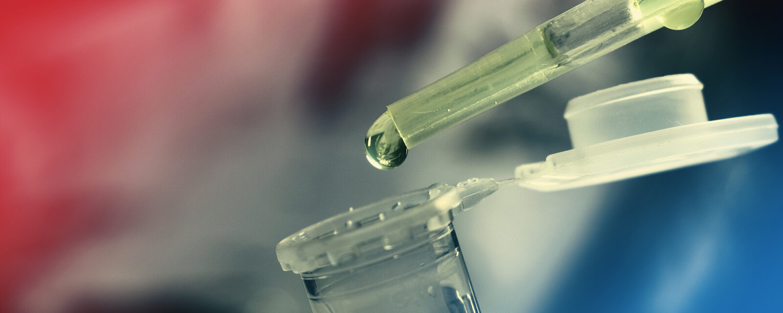 Image of a droplet dropping a substance into a test tube.
