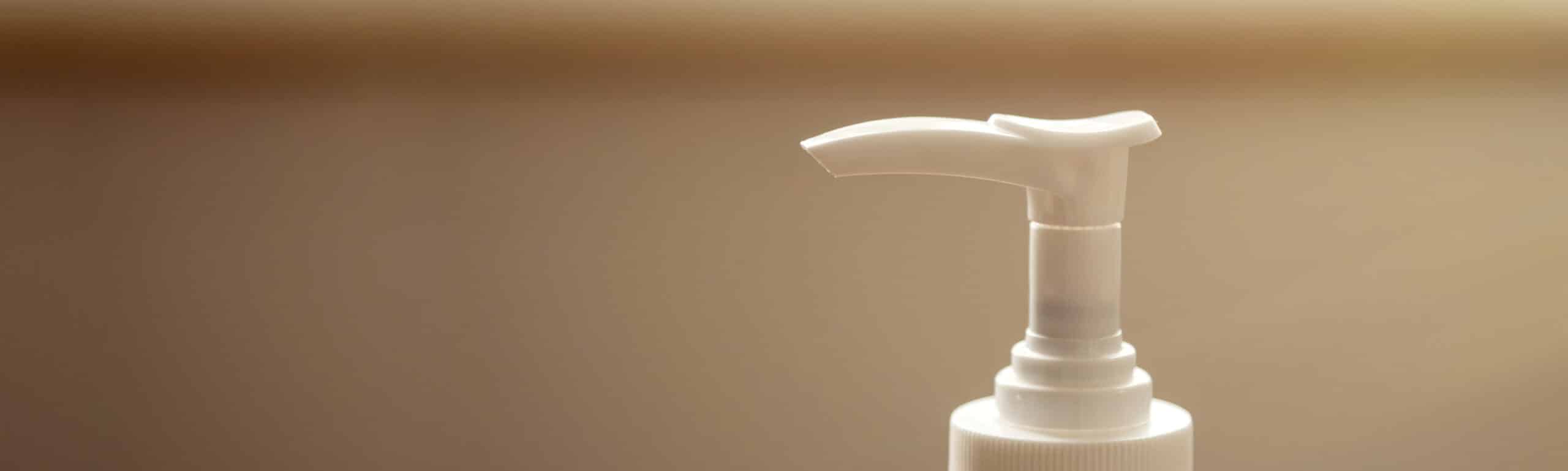 Close-up image of a hand sanitizer pump.