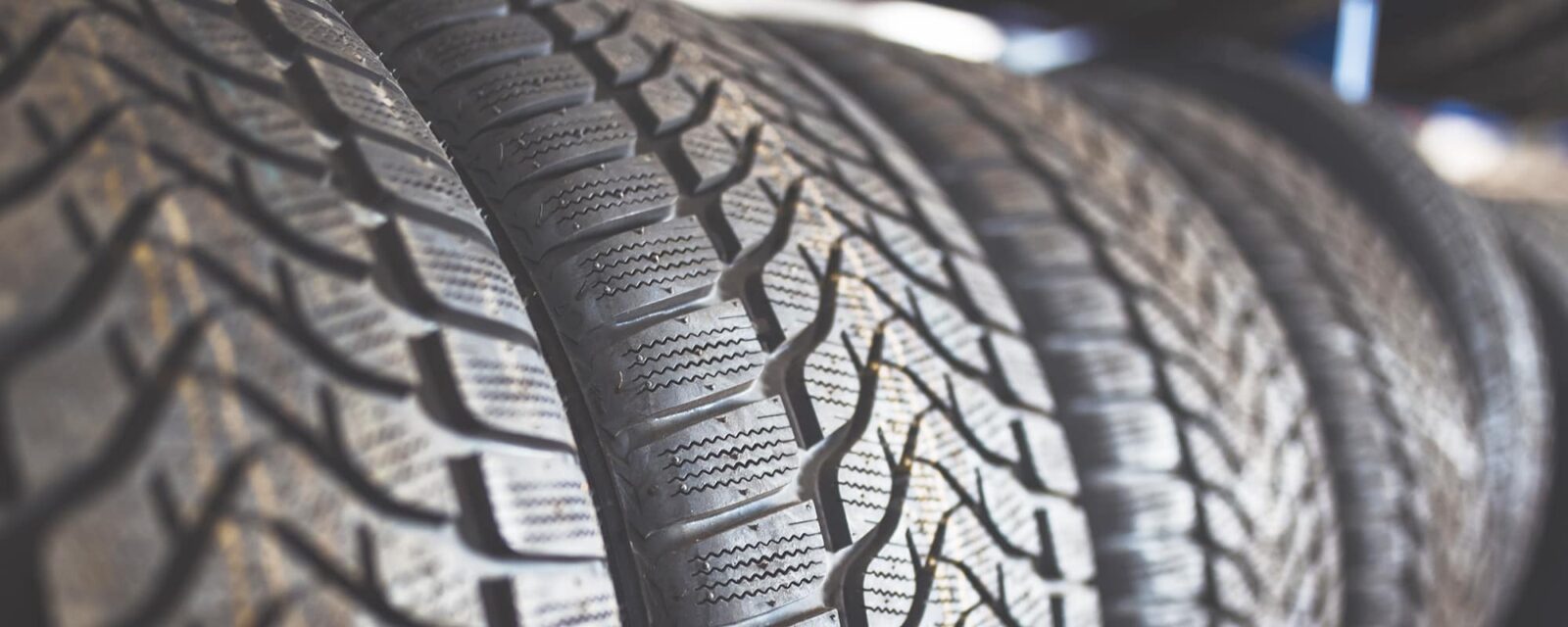 Close up image of several tires in a line.