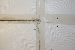 tear in Artex paint in the wall
