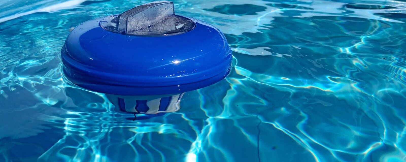 Close-up visual of chlorine pool with filter floating.