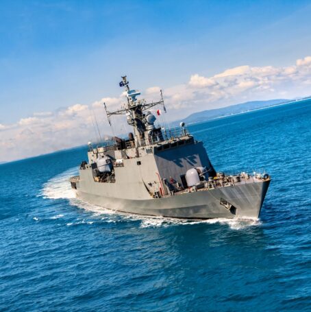 Photo of Navy ship on the water where military members were exposed to asbestos.