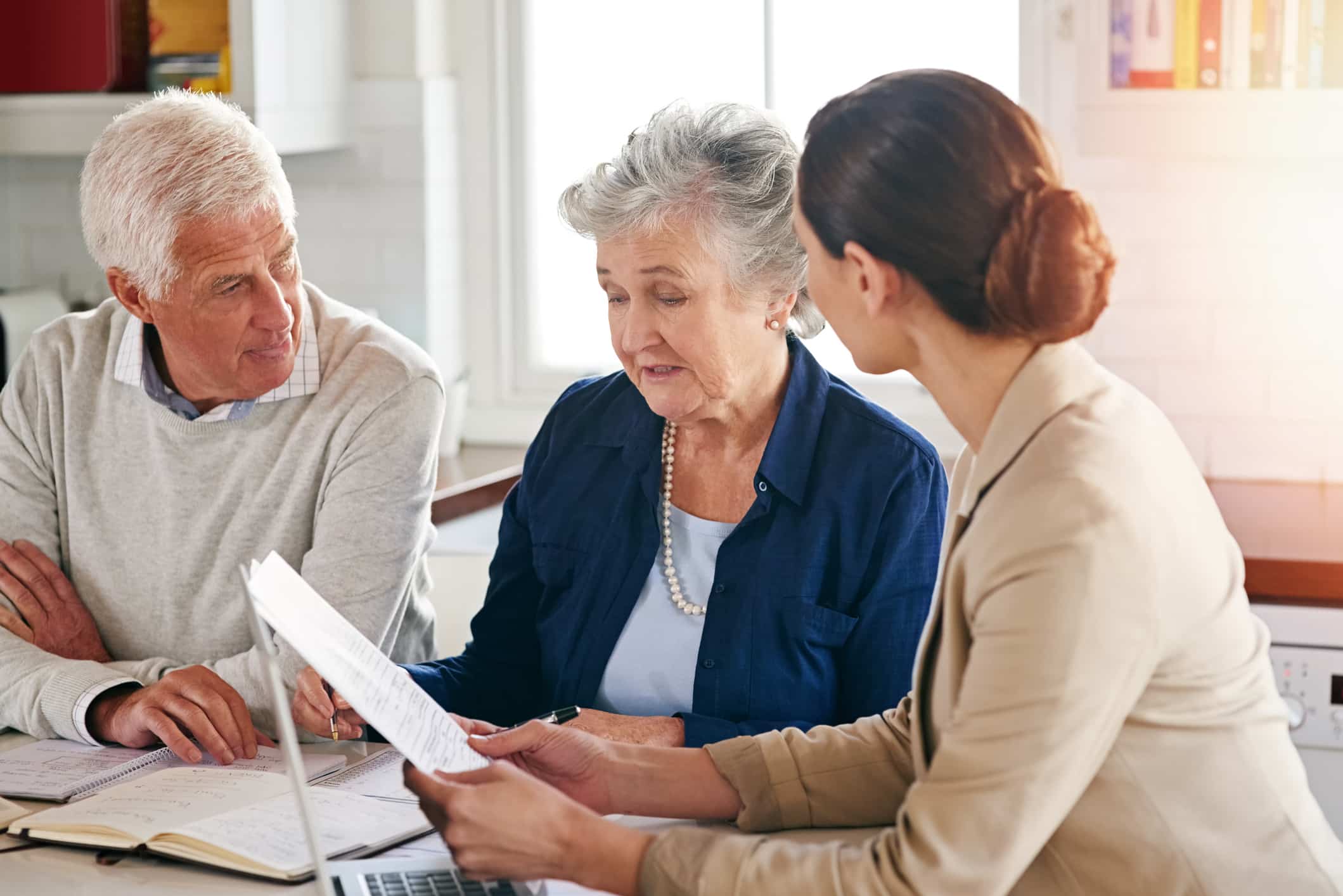 Caretaker helping mesothelioma patient make end of life decisions.