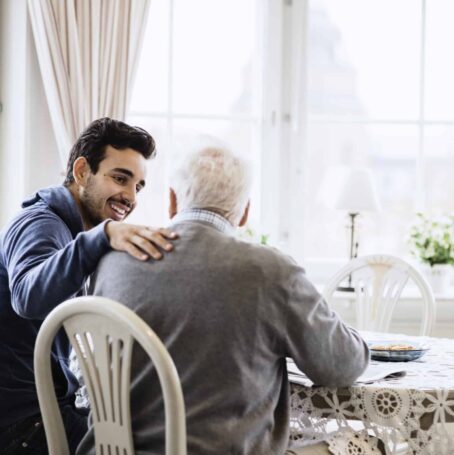 Caregiver showing support to mesothelioma patient on National Caregivers Day.