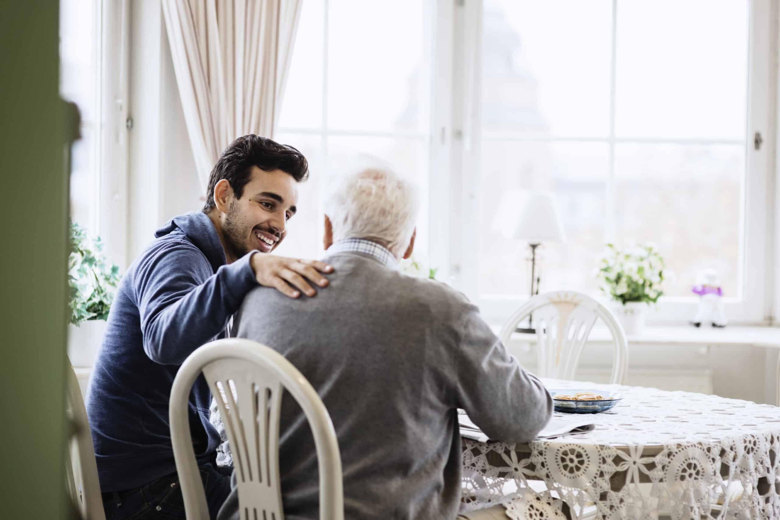 Caregiver showing support to mesothelioma patient on National Caregivers Day.