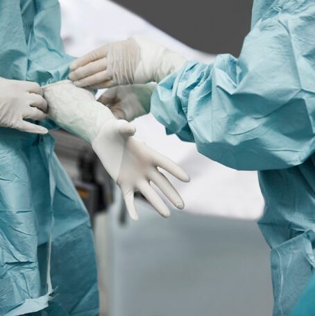 This image shows a team of surgeons preparing for an omentectomy treatment to remove cancerous tumors from the omentum and abdomen area.