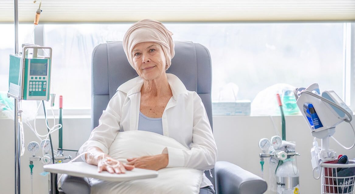 Female cancer patient receiving chemotherapy treatment.
