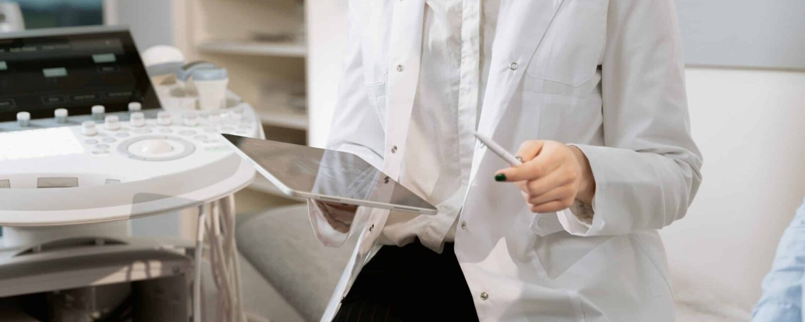 Female doctor in treatment room showing patient results