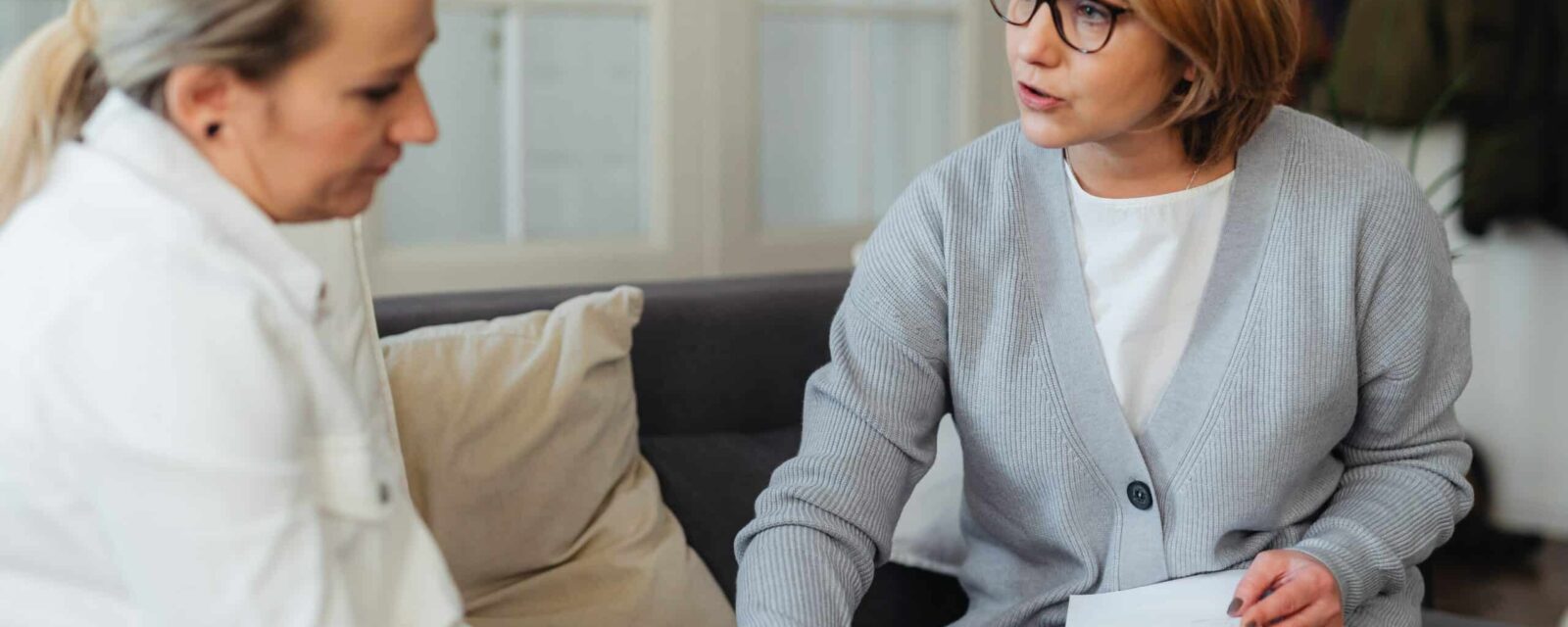 A therapist giving emotional support to a newly diagnosed mesothelioma patient.