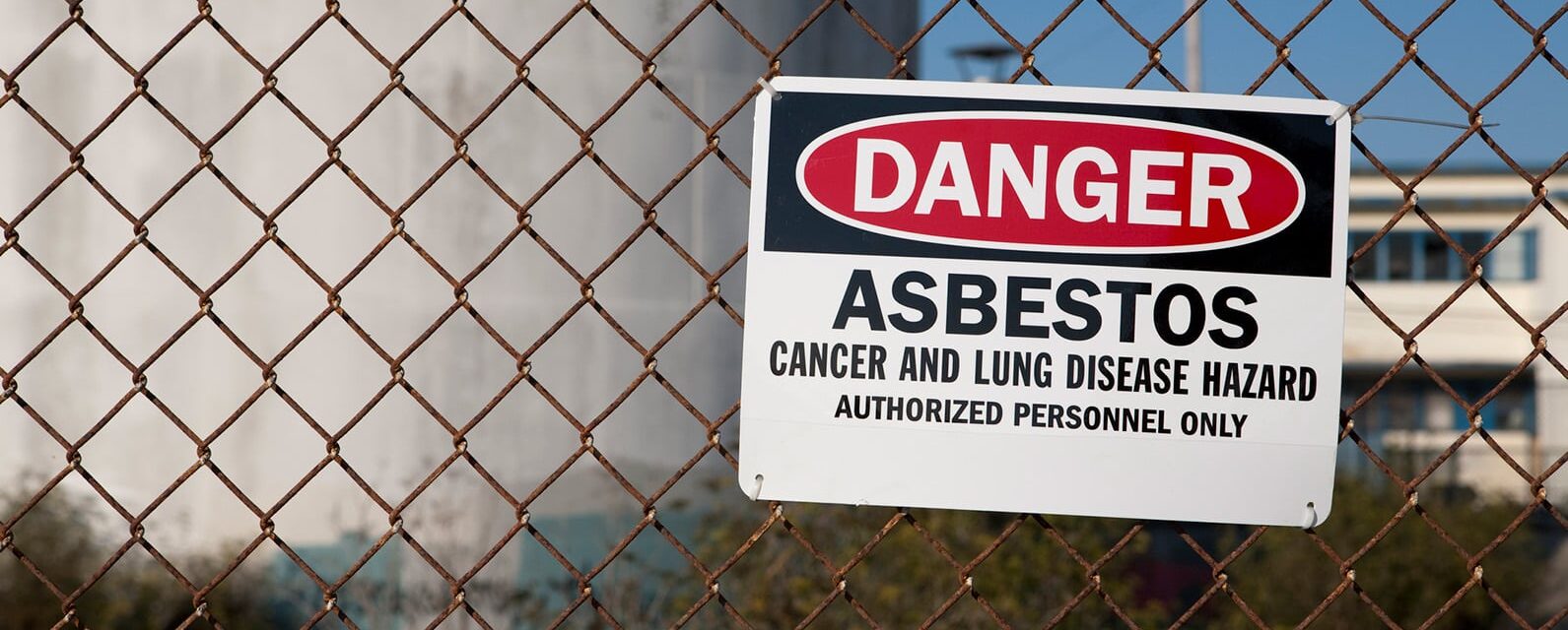 Asbestos companies sign warning citizens about cancer and lung disease hazard authorized personnel only.