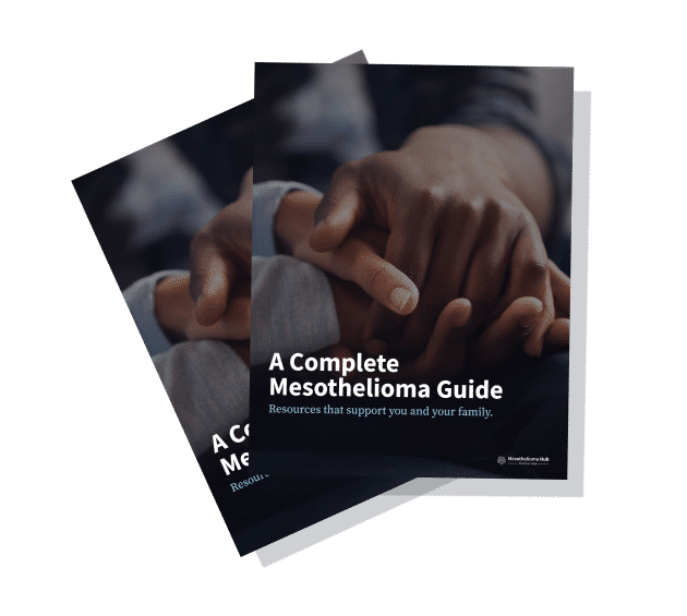 Booklets titled "A Complete Mesothelioma Guide" laying on top of each other.