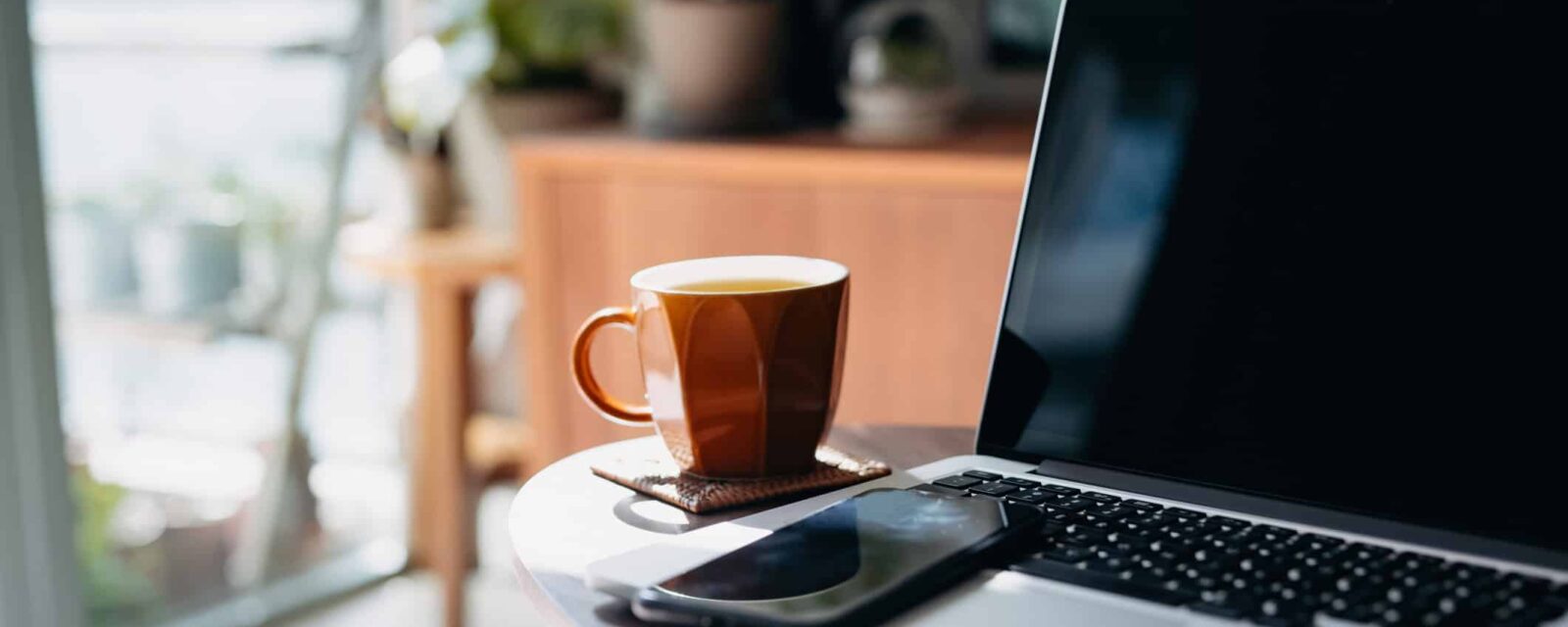 Laptop and coffee at legal reviewers desk