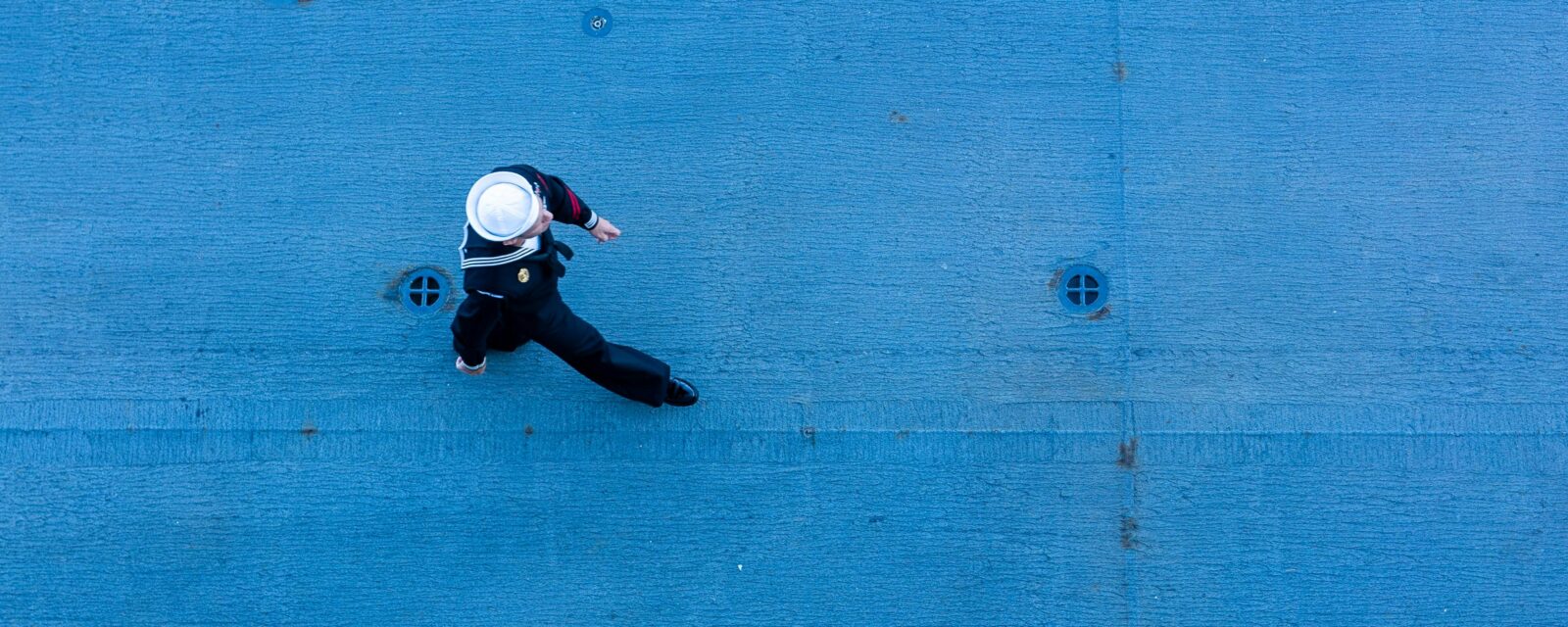 Photograph of Navy personnel walking at Pensacola Naval Air Station